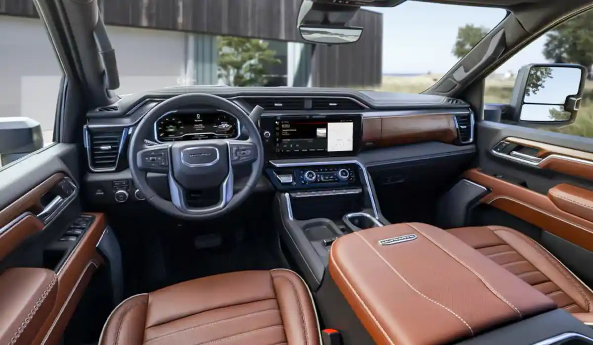The interior of the Sierra 2500HD and 3500HD is characterized by a spacious dashboard that houses user-friendly controls 2024 GMC 2500 HD